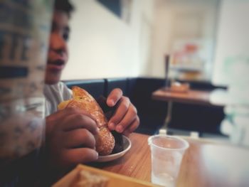 Midsection of man having breakfast