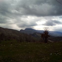 Scenic view of landscape against dramatic sky