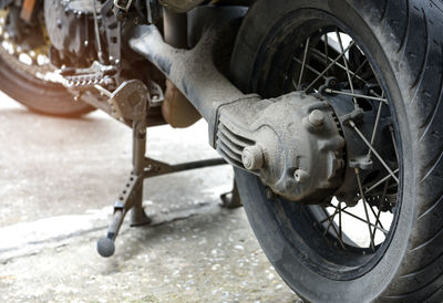 Close-up of motorcycle on road