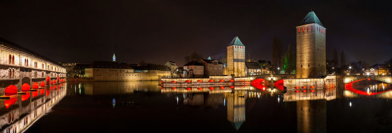 Illuminated buildings in city at night