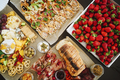 Fresh strawberries with platter of snacks