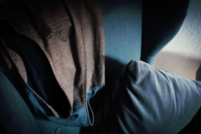 Close-up of clothes on sofa at home