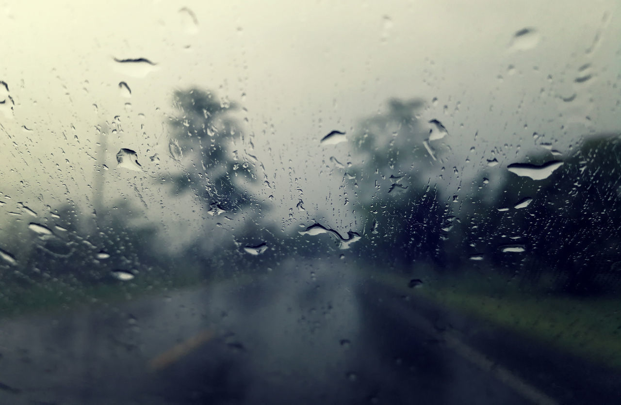 FULL FRAME SHOT OF RAINDROPS ON GLASS WINDOW