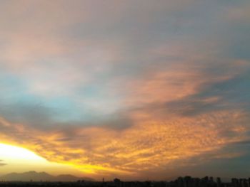 Low angle view of dramatic sky during sunset