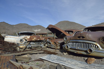 Old rusty car against sky