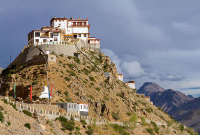 Buildings against mountain range