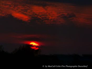 Scenic view of silhouette landscape against sky at sunset