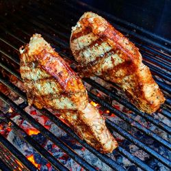 High angle view of meat on barbecue grill