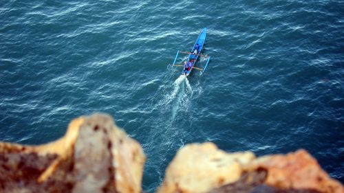 High angle view of people on boat in sea
