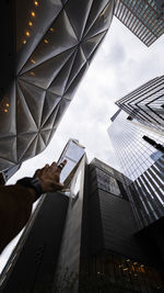 Low angle view of man using digital tablet