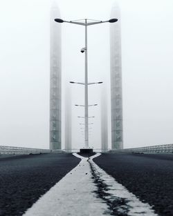 Road leading towards city during winter