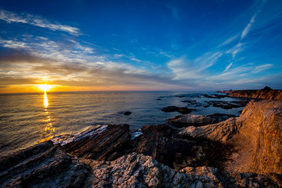 Scenic view of sea against sky during sunset