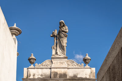 Low angle view of statue against clear sky