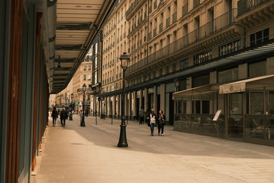 People walking on street in city
