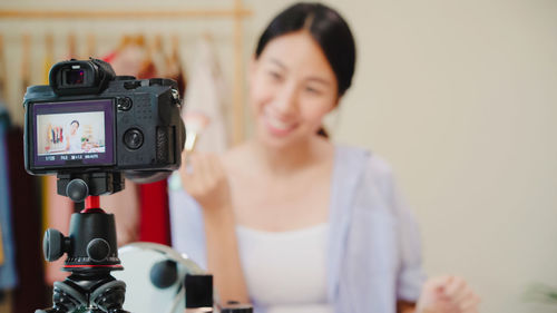 Close-up of woman photographing