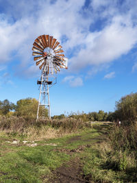 Rusty old wind pump at wheldrake ings nature reserve in north yorkshire, england