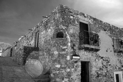 Low angle view of old building against sky