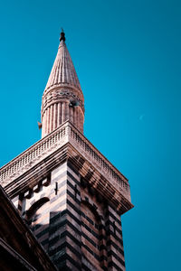 Low angle view of building against clear blue sky