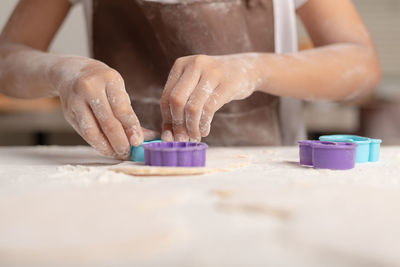 Midsection of woman working with ice cream