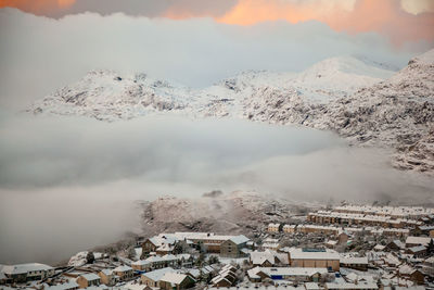 Aerial view of snowcapped mountain against sky