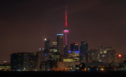 Illuminated buildings in city at night