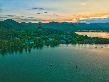 Scenic view of lake against sky during sunset