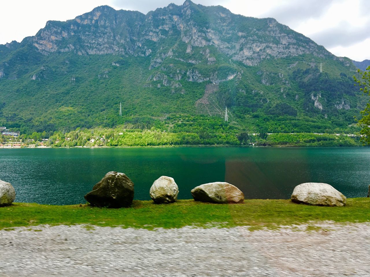 mountain, nature, beauty in nature, rock - object, water, outdoors, scenics, day, tranquility, tranquil scene, no people, lake, mountain range, grass, sky, animal themes