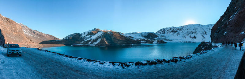 Scenic view of snowcapped mountains against clear blue sky