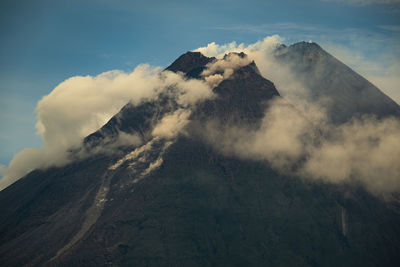 Scenic view of volcanic mountain against sky