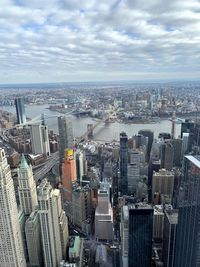 High angle view of modern buildings in city against sky