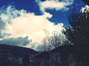 Low angle view of building against cloudy sky