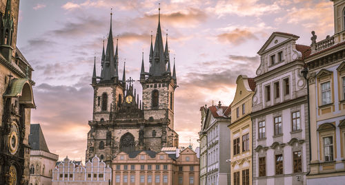 Church of our lady before tyn against sky during sunset