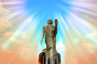 Low angle view of statue against sky