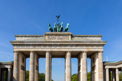 Low angle view of statue against sky