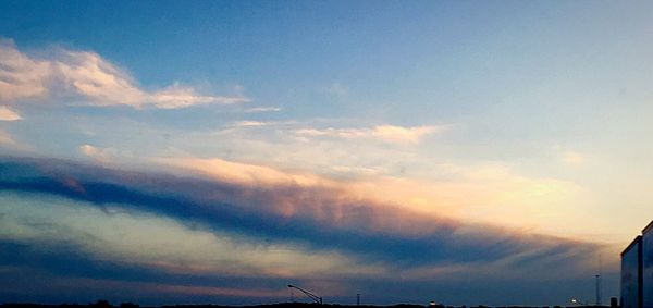 Low angle view of cloudy sky at sunset