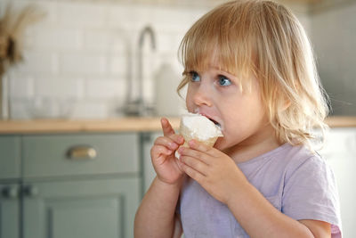 Close-up of girl eating food