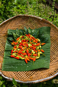 High angle view of chili peppers in basket