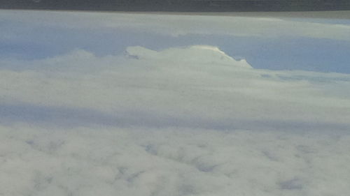Aerial view of clouds covering landscape