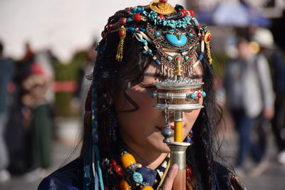 Close-up portrait of woman wearing mask