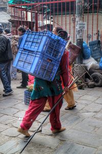 Woman standing on city street