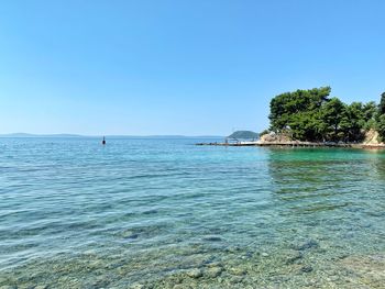 Scenic view of sea against clear sky