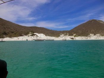 Scenic view of mountains against cloudy sky