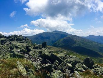 Scenic view of mountains against cloudy sky