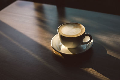 High angle view of coffee cup on table