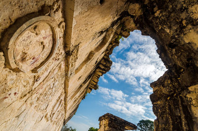 Low angle view of mayan ruins against sky at palenque