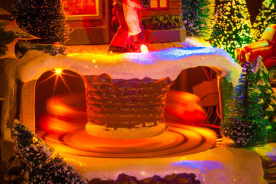 Close-up of illuminated lighting equipment on table