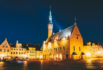 Illuminated buildings in city at night