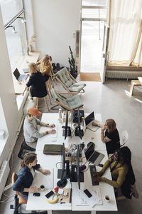 High angle view of people working at table