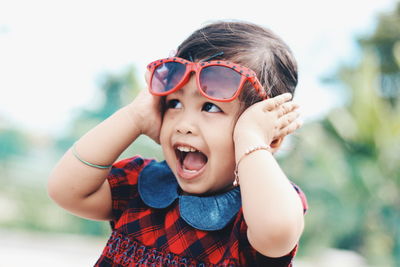 Close-up portrait of smiling girl