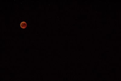 Low angle view of moon against sky at night